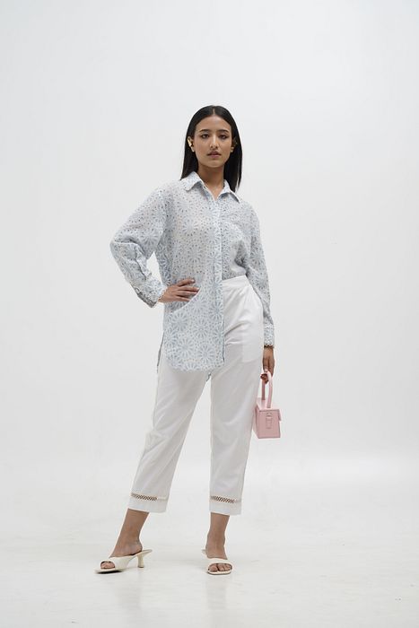 A model showcasing Mia Quirky Embroidery Shirt by Stitch Stories from Stitch Stories's collection