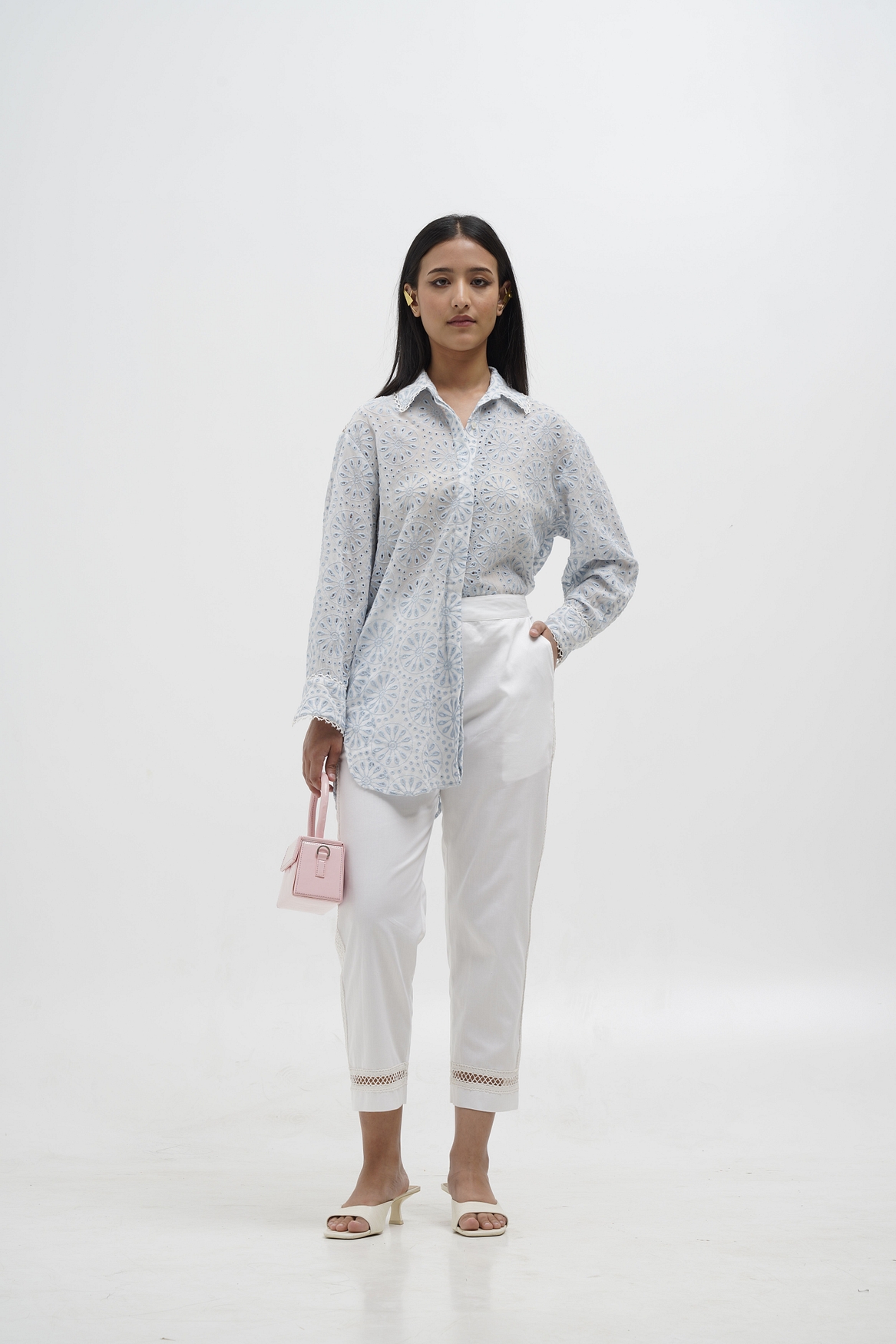 A model showcasing Mia Quirky Embroidery Shirt Feature image by Stitch Stories from Stitch Stories's collection
