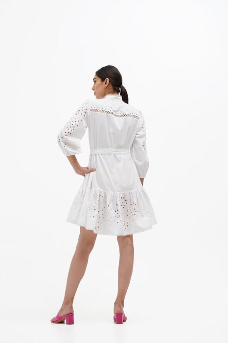 A model showcasing Dove Puffed Sleeve Dress by Stitch Stories from Stitch Stories's collection