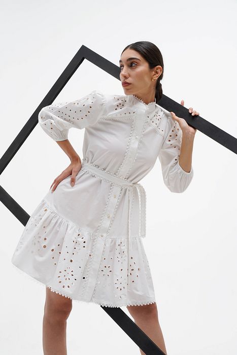 A model showcasing Dove Puffed Sleeve Dress by Stitch Stories from Stitch Stories's collection