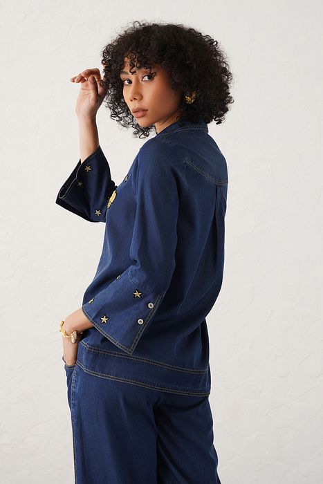 A model showcasing Grazia Shirt by Stitch Stories from Stitch Stories's collection