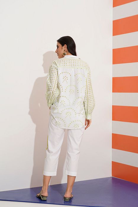 A model showcasing Cleo Shirt With Cut Work Embroidery by Stitch Stories from Stitch Stories's collection