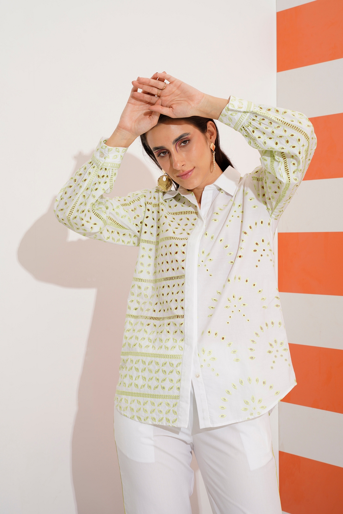A model showcasing Cleo Shirt With Cut Work Embroidery Feature image by Stitch Stories from Stitch Stories's collection