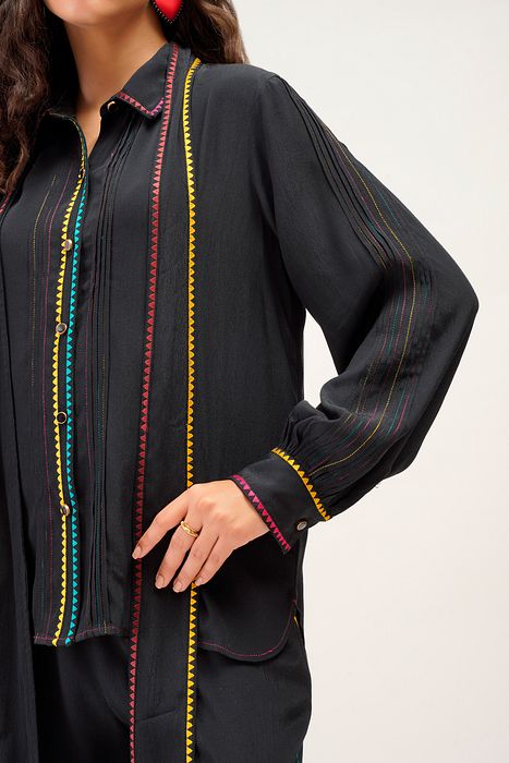A model showcasing Elodie Shirt by Stitch Stories from Stitch Stories's collection