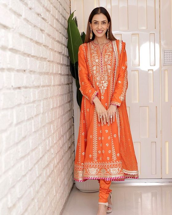 A model showcasing Smriti Khanna In Orange Golconda Aarohi Anarkali Set by Gopi Vaid from Gopi Vaid's collection