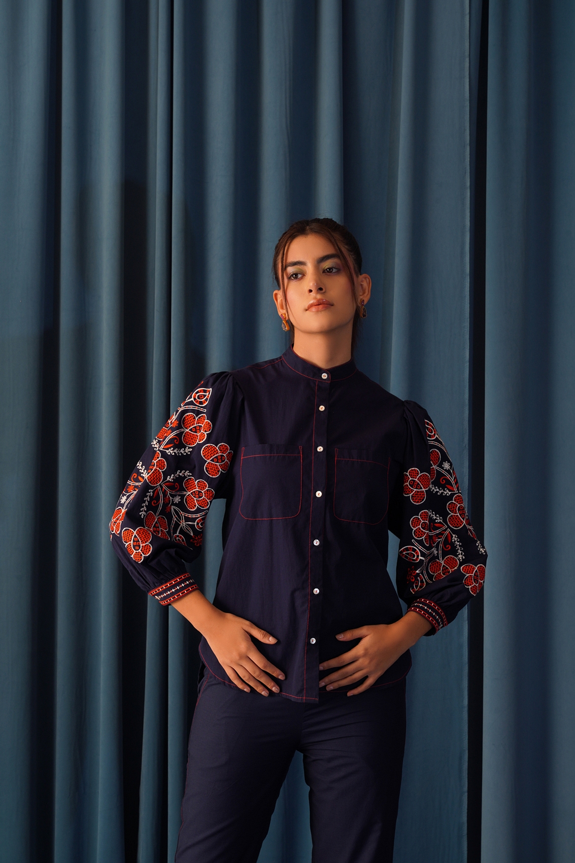 A model showcasing Daisy Embroidered Shirt Feature image by Stitch Stories from Stitch Stories's collection