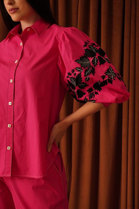 A model showcasing Raine Shirt by Stitch Stories from Stitch Stories's collection