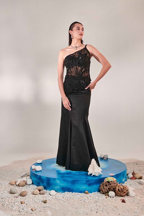 A model showcasing Corset Top And Skirt Set by One Knot One from One Knot One's collection