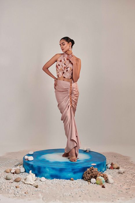 A model showcasing Nudish Pink Skirt Set by One Knot One from One Knot One's collection