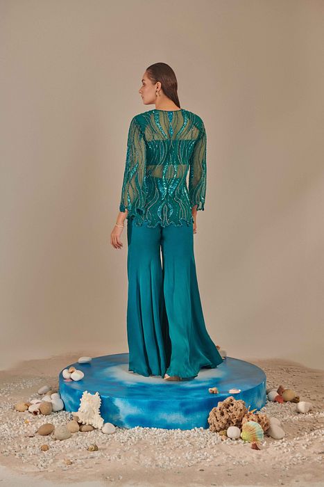 A model showcasing Teal Cutwork Jacket Set by One Knot One from One Knot One's collection