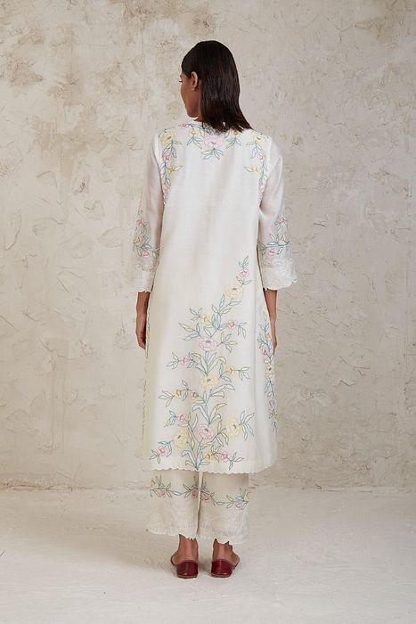 A model showcasing Aima Off White A Line Kurta Set by Sue Mue from Sue Mue's collection