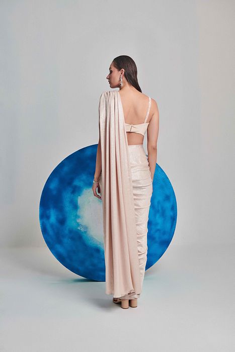 A model showcasing Ivory Pre Stitch Drape Saree by One Knot One from One Knot One's collection