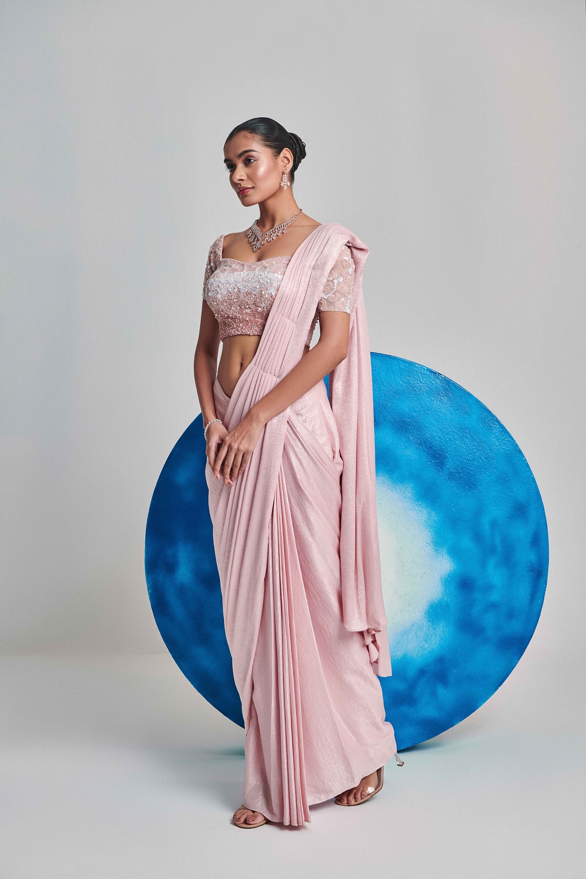 A model showcasing Soft Pink Ombre Pre Stitch Drape Saree Feature image by One Knot One from One Knot One's collection