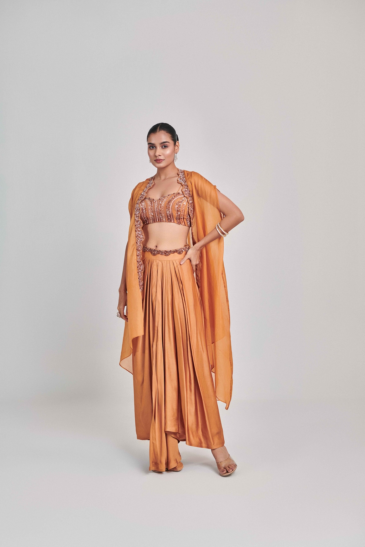 A model showcasing Mustard Cutowork Cape Skirt Set Feature image by One Knot One from One Knot One's collection