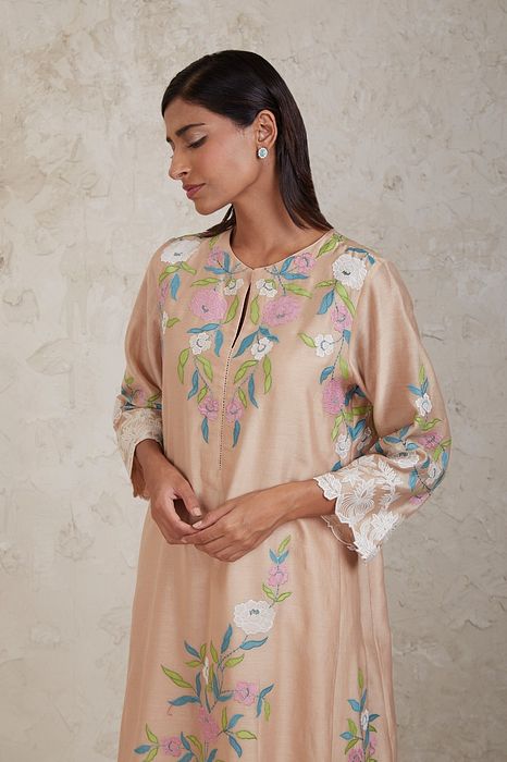 A model showcasing Aima Beige A Line Kurta Set by Sue Mue from Sue Mue's collection