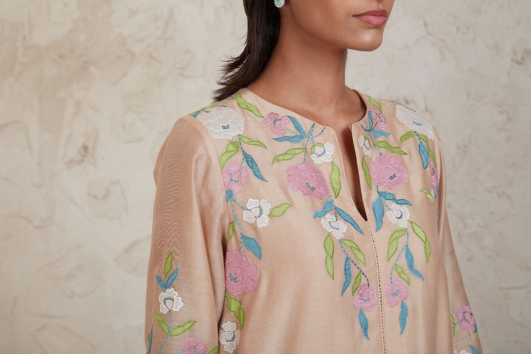 A model showcasing Aima Beige A Line Kurta Set by Sue Mue from Sue Mue's collection