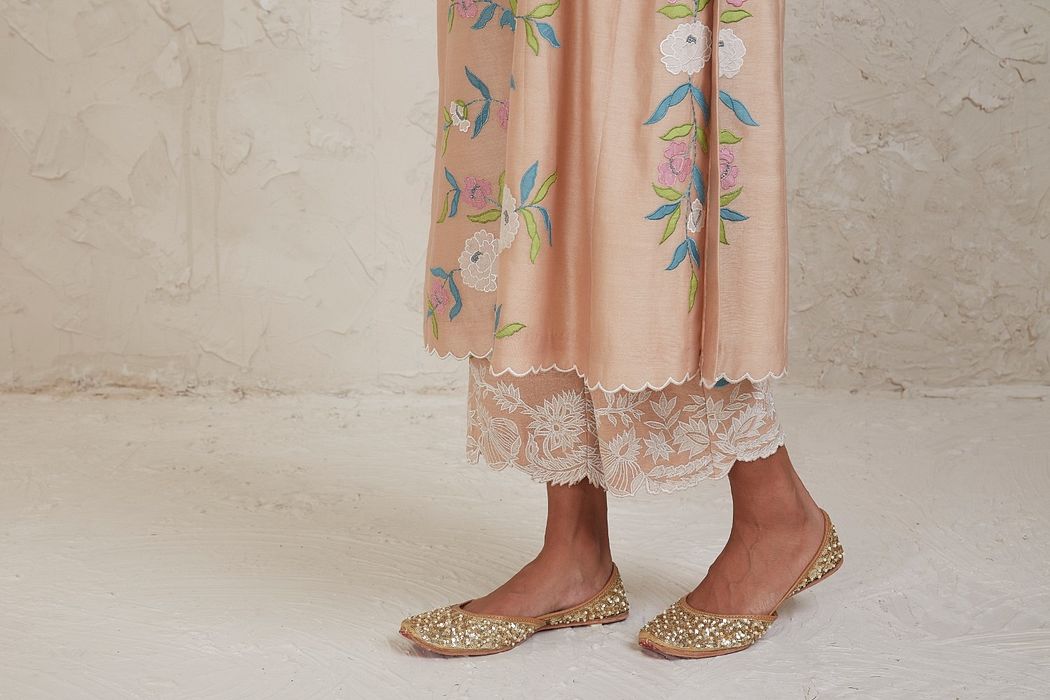 A model showcasing Aima Beige A Line Kurta Set by Sue Mue from Sue Mue's collection