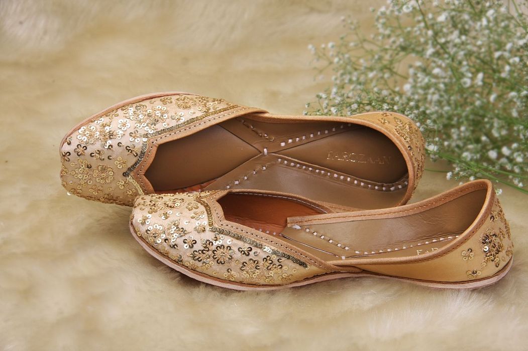 A model showcasing Golden Blooms Sequin Shines by Farozaan from Farozaan's collection