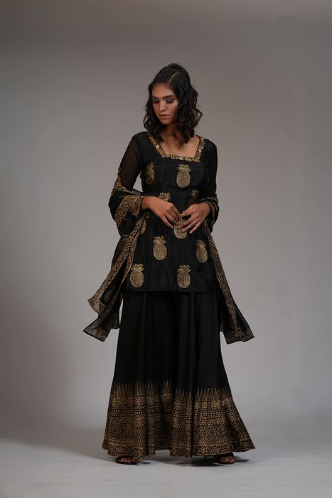 A model showcasing Ananaas Hand Block Printed Sharara Set In Silk by Shruti S Label from Shruti S Label's collection