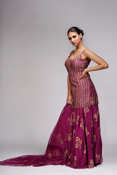 A model showcasing Hand Work Block Print Wine Sharara Suit by Shruti S Label from Shruti S Label's collection