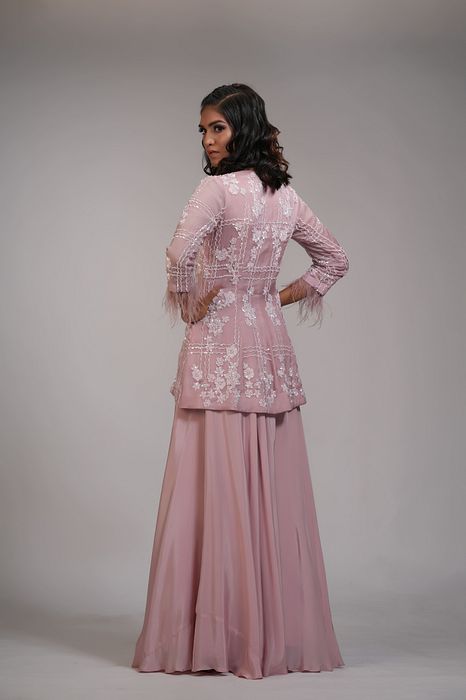 A model showcasing Pink Embroidery Sharara With Feathers by Shruti S Label from Shruti S Label's collection