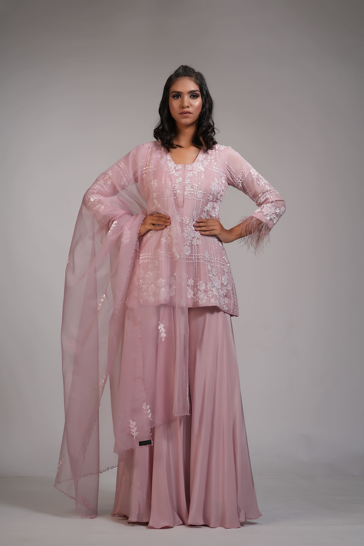 A model showcasing Pink Embroidery Sharara With Feathers Feature image by Shruti S Label from Shruti S Label's collection