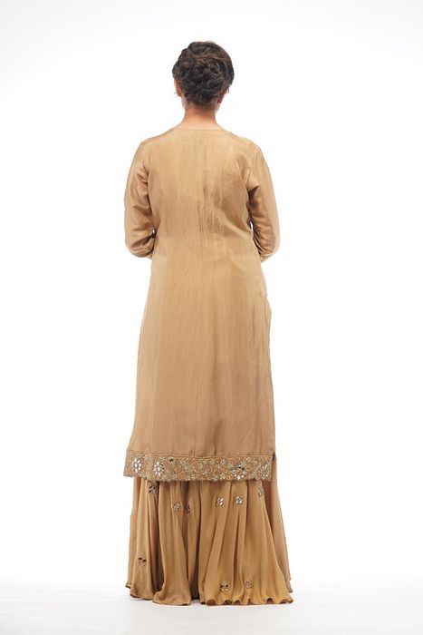 A model showcasing Zari And Mirror Cutwork Sharara Set With Long Shirt by Shruti S Label from Shruti S Label's collection