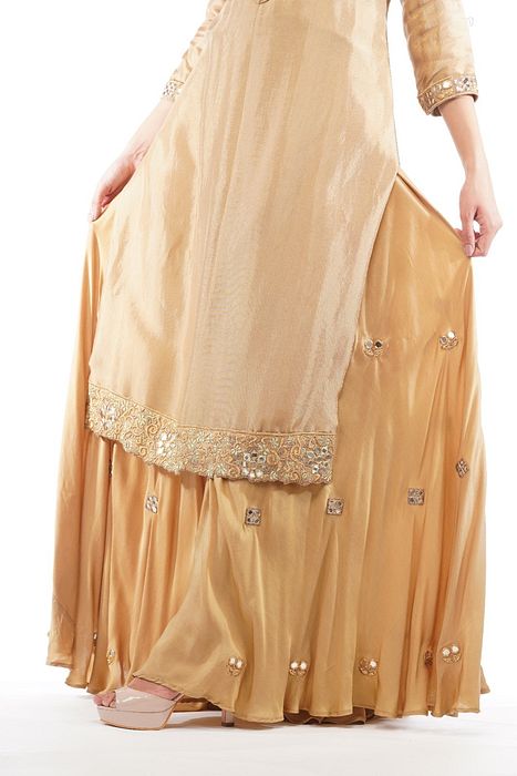 A model showcasing Zari And Mirror Cutwork Sharara Set With Long Shirt by Shruti S Label from Shruti S Label's collection
