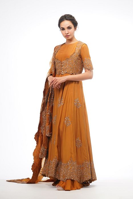 A model showcasing Classic Jacket Anarkali In Ochre by Shruti S Label from Shruti S Label's collection