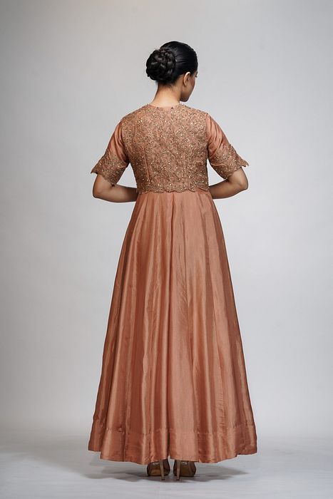 A model showcasing Classic Jacket Anarkali In Cinnamon by Shruti S Label from Shruti S Label's collection