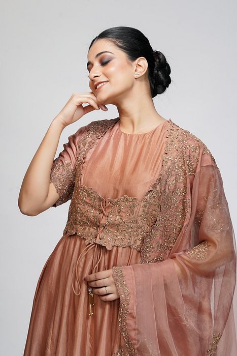 A model showcasing Classic Jacket Anarkali In Cinnamon by Shruti S Label from Shruti S Label's collection