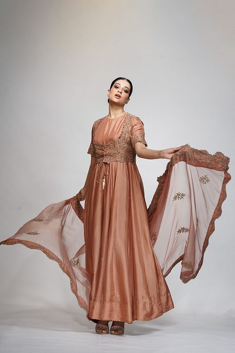 A model showcasing Classic Jacket Anarkali In Cinnamon by Shruti S Label from Shruti S Label's collection
