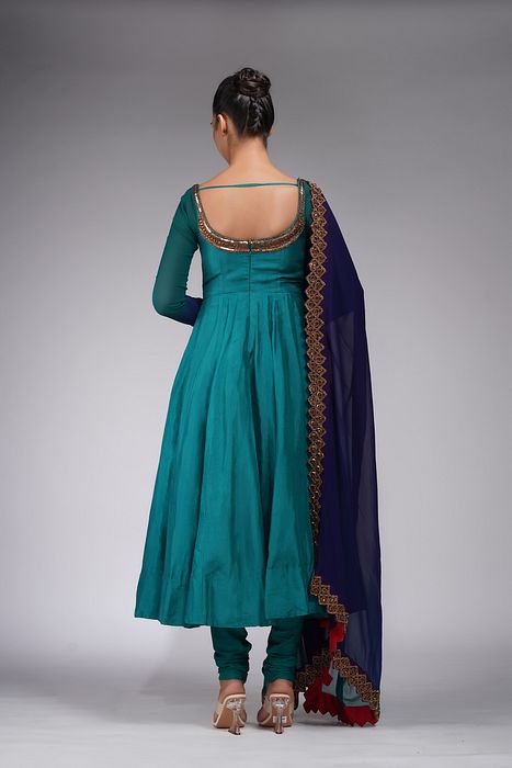 A model showcasing Teal Anarkali With Gold Embroidery by Shruti S Label from Shruti S Label's collection