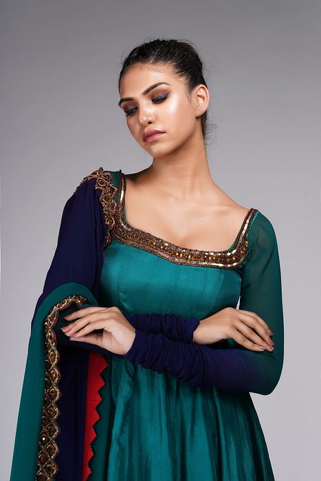 A model showcasing Teal Anarkali With Gold Embroidery by Shruti S Label from Shruti S Label's collection