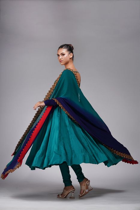 A model showcasing Teal Anarkali With Gold Embroidery by Shruti S Label from Shruti S Label's collection