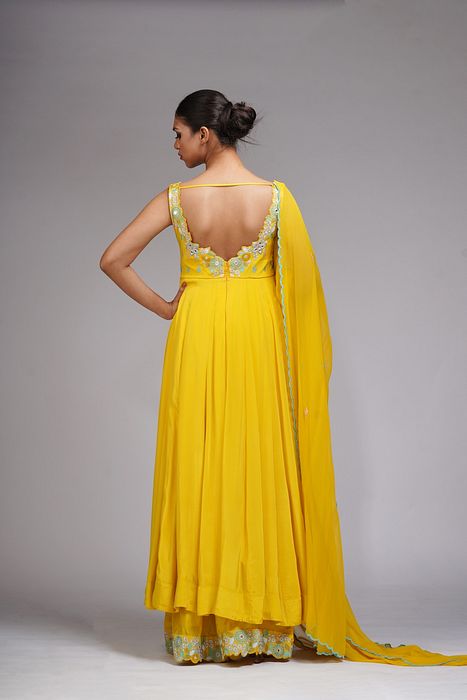 A model showcasing Thread Mirror Work Anarkali In Yellow by Shruti S Label from Shruti S Label's collection