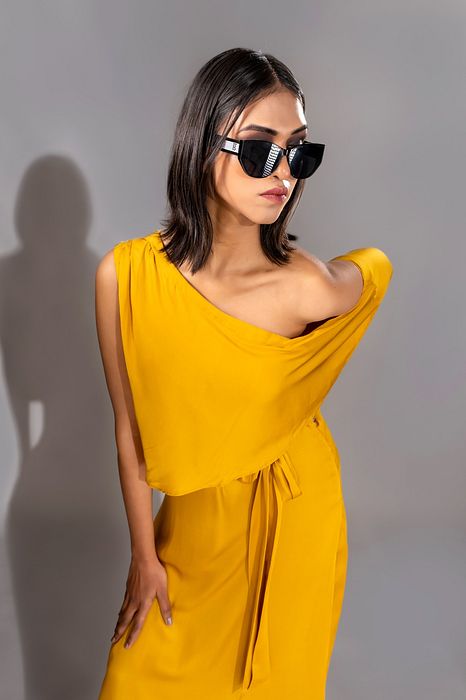 A model showcasing Yellow Off Shoulder Maxi Dress by Shruti S Label from Shruti S Label's collection