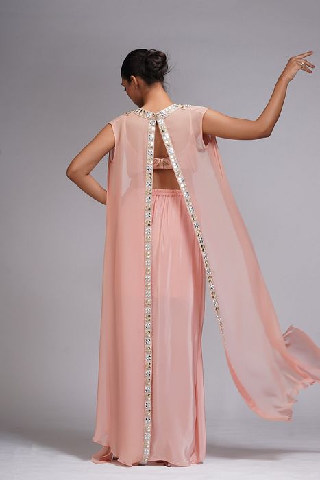 A model showcasing Peach Draped Dhoti Skirt And Cape by Shruti S Label from Shruti S Label's collection