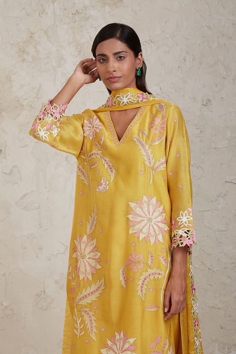 A model showcasing Daria Yellow A Line Kurta Set by Sue Mue from Sue Mue's collection