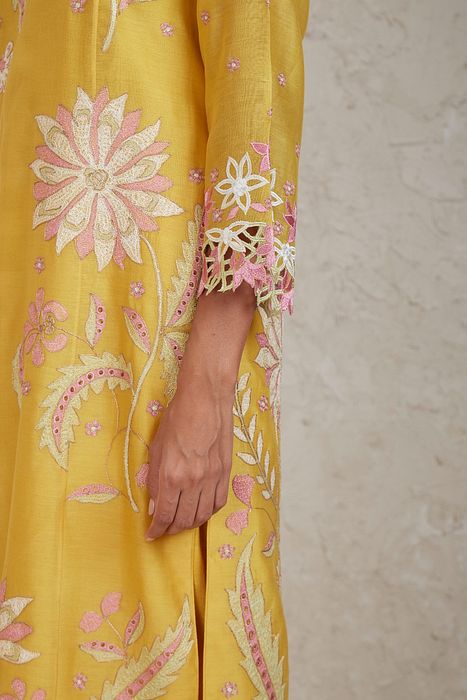 A model showcasing Daria Yellow A Line Kurta Set by Sue Mue from Sue Mue's collection