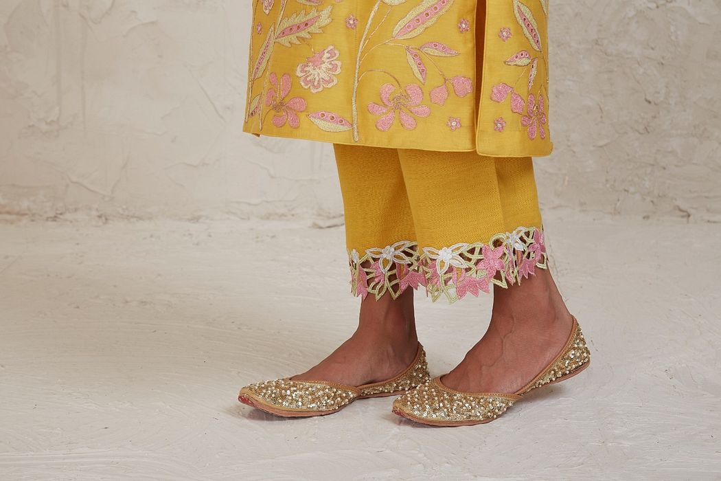 A model showcasing Daria Yellow A Line Kurta Set by Sue Mue from Sue Mue's collection