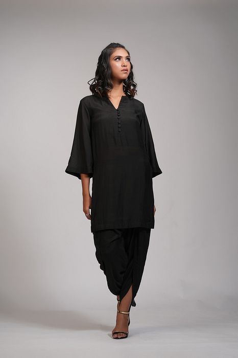 A model showcasing Black Kurta Dhoti Salwaar Set by Shruti S Label from Shruti S Label's collection