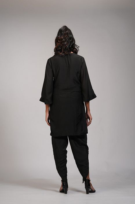 A model showcasing Black Kurta Dhoti Salwaar Set by Shruti S Label from Shruti S Label's collection