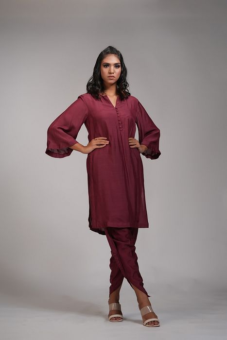 A model showcasing Maroon Kurta And Dhoti Salwaar Set by Shruti S Label from Shruti S Label's collection