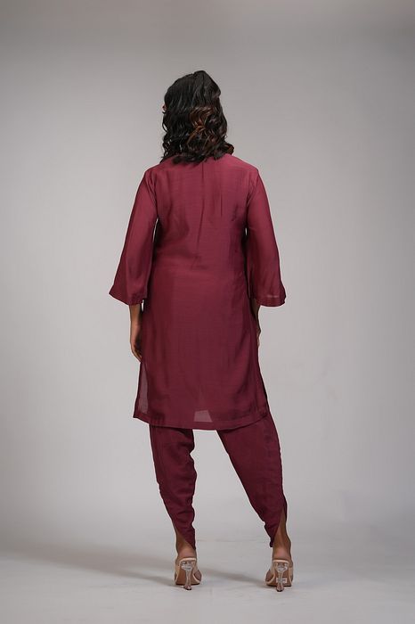 A model showcasing Maroon Kurta And Dhoti Salwaar Set by Shruti S Label from Shruti S Label's collection