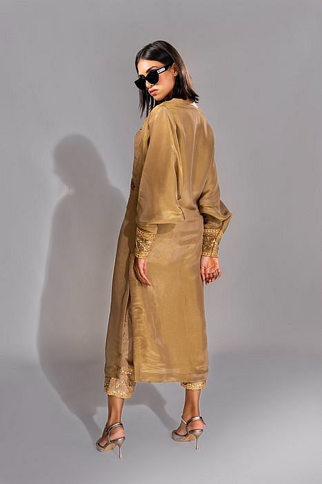 A model showcasing Golden Kaftan Suit by Shruti S Label from Shruti S Label's collection