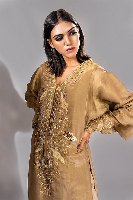 A model showcasing Golden Kaftan Suit by Shruti S Label from Shruti S Label's collection