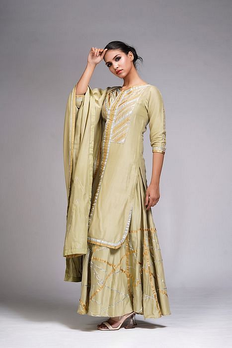 A model showcasing Abstract Gotta Work Sharara Suit by Shruti S Label from Shruti S Label's collection