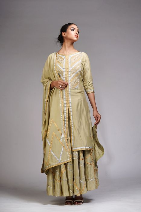 A model showcasing Abstract Gotta Work Sharara Suit by Shruti S Label from Shruti S Label's collection