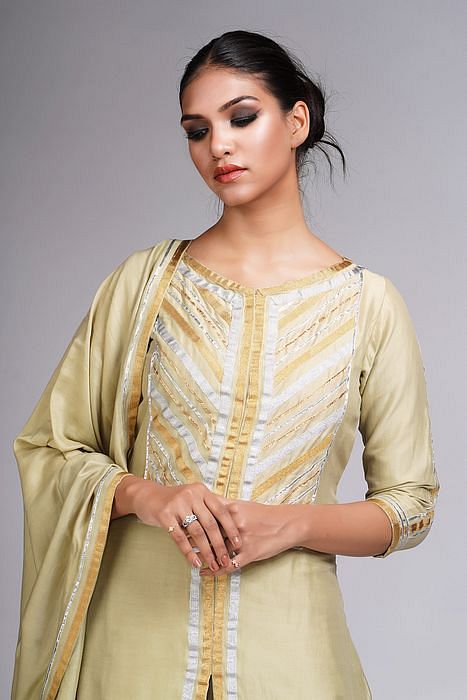 A model showcasing Abstract Gotta Work Sharara Suit by Shruti S Label from Shruti S Label's collection